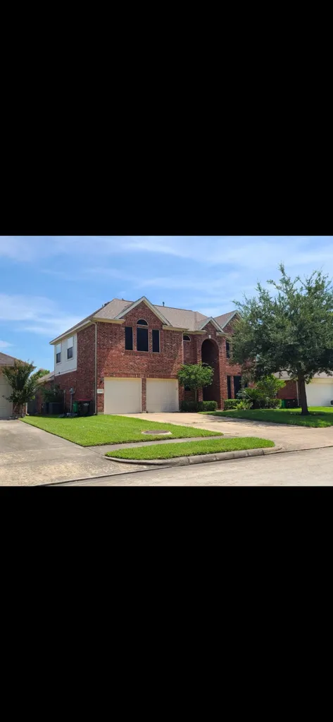 Two-story brick home exterior, southeast Louisiana